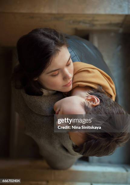 two young women embrace each other, outdoor - fu ying foto e immagini stock