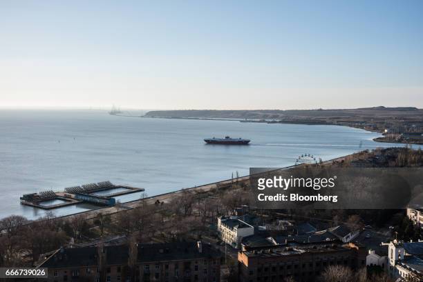Ferry sails into the Kerch Strait waterway transporting people and goods in and out of the pensinsula in Kerch, Crimea, on Sunday, Feb. 26, 2017....