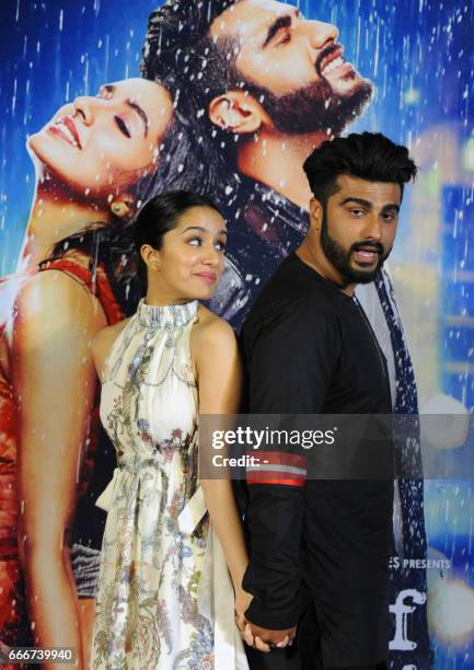 Indian Bollywood actors Shraddha Kapoor and Arjun Kapoor attend the trailer launch of the Hindi film "Half Girlfriend" in Mumbai on April 10, 2017. /...