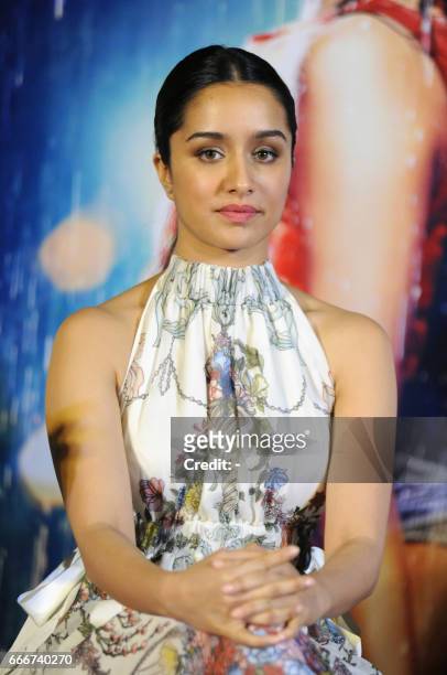 Indian Bollywood actors Shraddha Kapoor attends the trailer launch of the Hindi film "Half Girlfriend" in Mumbai on April 10, 2017. / AFP PHOTO / -