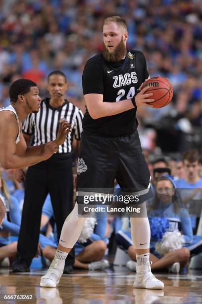 Przemek Karnowski of the Gonzaga Bulldogs moves the ball against Kennedy Meeks of the North Carolina Tar Heels during the 2017 NCAA Men's Final Four...