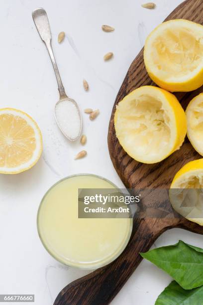 fresh lemon juice, lemonade - squeezing stock pictures, royalty-free photos & images