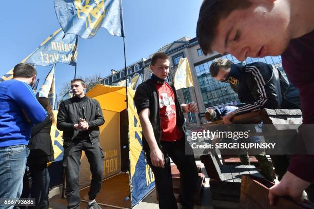 Activists set up a camp in front of Russian owned Sberbank Bank in Kiev on April 10, 2017. Ukrainian activists declared the permanent blocking of all...