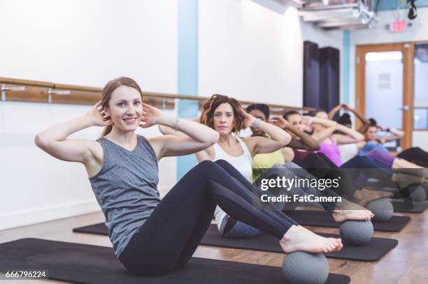 multi-ethnic group of women doing barre workout - hesitant to dance stock pictures, royalty-free photos & images