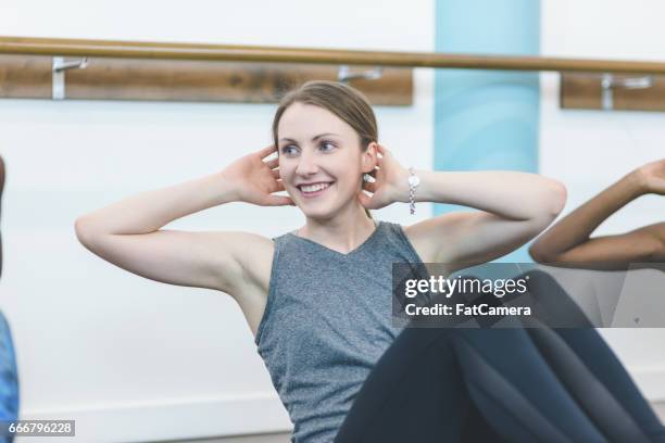 multi-ethnic group of women doing barre workout - hesitant to dance stock pictures, royalty-free photos & images