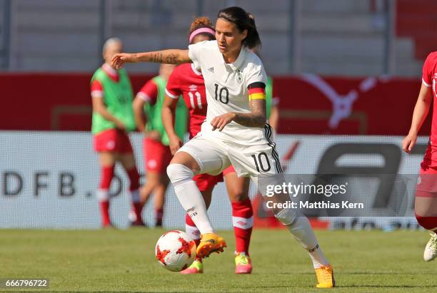 Dzsenifer Marozsan of Germany runs with the ball during the women's international friendly match between Germany and Canada at Steigerwald Stadion on...