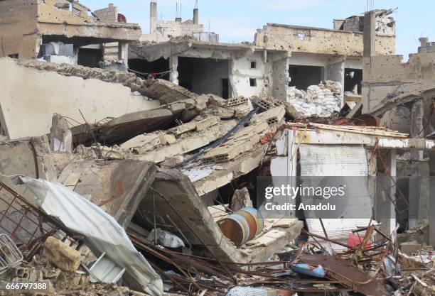 Collapsed buildings are seen after the war crafts belonging to the Syrian Regime Forces bombed the Menshiyye neighborhood as Syrian military...