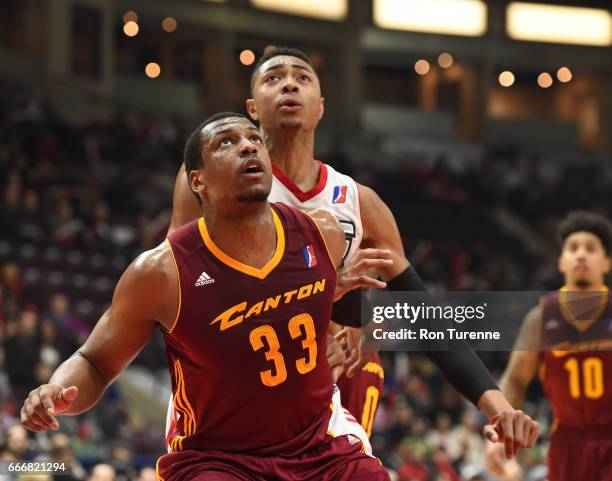 April 8 : Jonathan Holmes of the Canton Charge fights for the rebound with Bruno Caboclo of the Raptors 905 at the Hershey Centre on April 8, 2017 in...