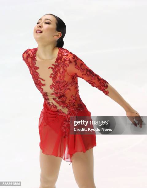 Japanese figure skater Mao Asada reacts after finishing her free skate at the national championships in Kadoma, Osaka Prefecture, in December 2016,...