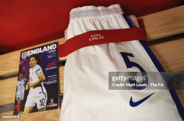 Detail view showing the match programme and a pair of England shorts inside the dressing room prior to the Women's International Friendly match...