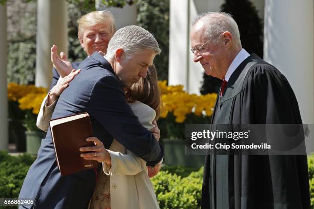 Supreme Court Associate Justice Neil Gorsuch embraces his wife Marie Louise Gorsuch after he was administerd the judicial oath by Associate Justice...