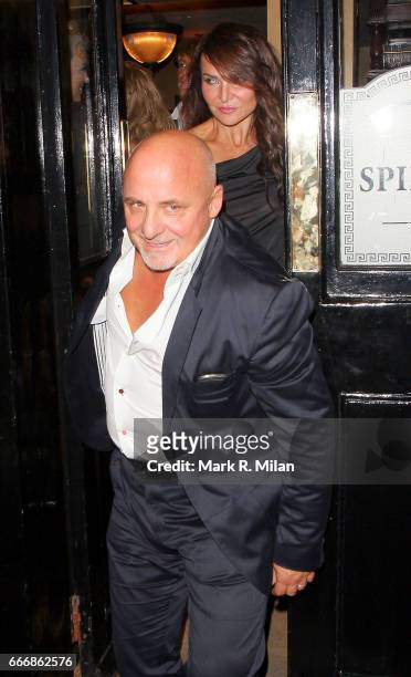 Aldo Zilli and Lizzie Cundy depart the birthday celebration of Gary Cockerill held at Guy Richie's pub "The Punch Bowl" on October 1, 2011 in London,...