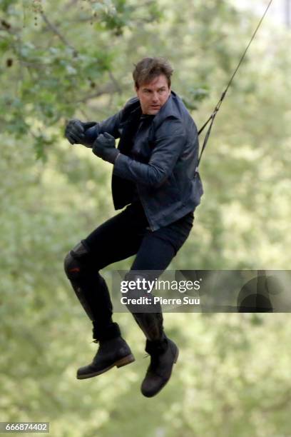 Actor Tom Cruise performs a stunt on set for 'Mission:Impossible 6 Gemini' filming on April 10, 2017 in Paris, France.