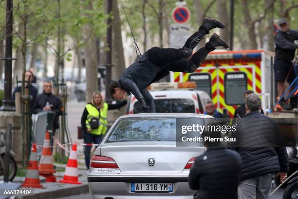 Actor Tom Cruise performs a stunt on set for 'Mission:Impossible 6 Gemini' filming on April 10, 2017 in Paris, France.