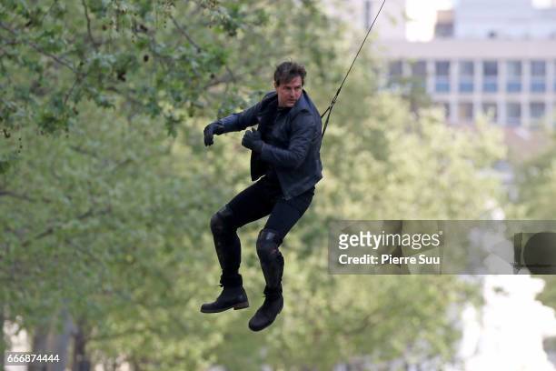 Actor Tom Cruise performs a stunt on set for 'Mission:Impossible 6 Gemini' filming on April 10, 2017 in Paris, France.