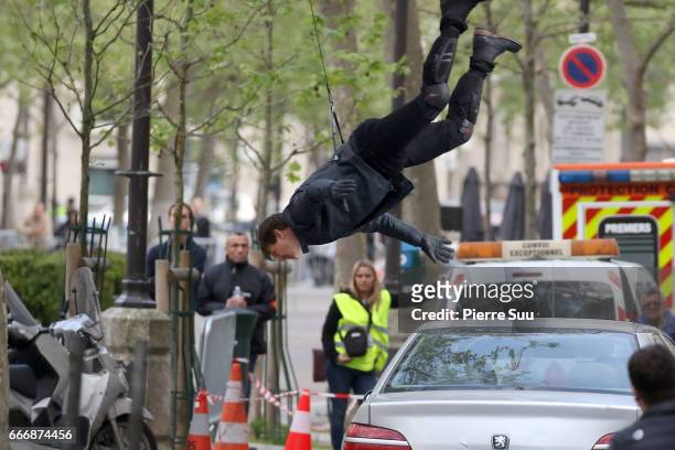 Actor Tom Cruise performs a stunt on set for 'Mission:Impossible 6 Gemini' filming on April 10, 2017 in Paris, France.