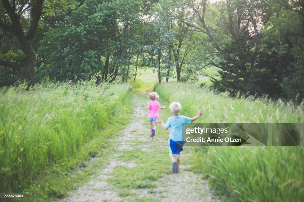 Running Down Path Kids Running Down A Path High-Res Stock Photo - Getty Images