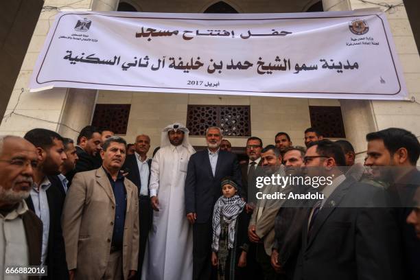 Ismail Haniyeh, the deputy leader of Hamas and Khalid al-Hardan Deputy Head of the reconstruction committee in Gaza are seen during the opening...