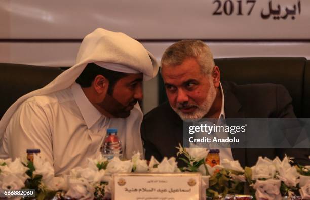 Ismail Haniyeh, the deputy leader of Hamas and Khalid al-Hardan Deputy Head of the reconstruction committee in Gaza are seen during the opening...