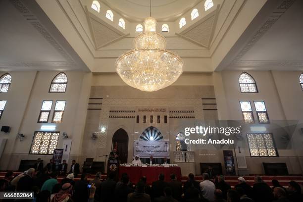 Ismail Haniyeh, the deputy leader of Hamas and Khalid al-Hardan Deputy Head of the reconstruction committee in Gaza are seen during the opening...