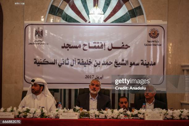 Ismail Haniyeh, the deputy leader of Hamas and Khalid al-Hardan Deputy Head of the reconstruction committee in Gaza are seen during the opening...