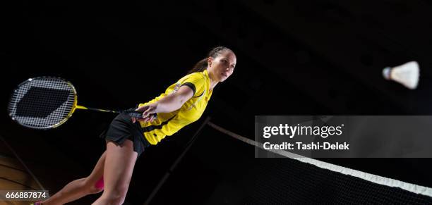 woman playing badminton - women's badminton stock pictures, royalty-free photos & images