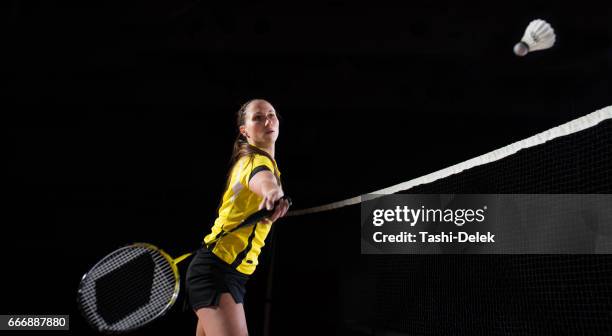 woman playing badminton - women's badminton stock pictures, royalty-free photos & images