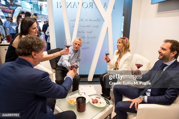 Angelo Baiguera, Thais Souza Wiggers, Rossana Bettini, Riccardo Illy and Paul Baccaglini, President of Palermo, visit Vinitaly on April 10, 2017 in...