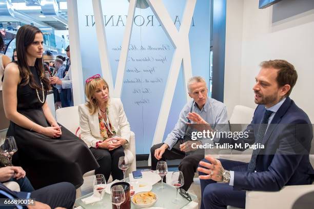 Thais Souza Wiggers, Rossana Bettini, Riccardo Illy and Paul Baccaglini, President of Palermo, visit Vinitaly on April 10, 2017 in Verona, Italy.