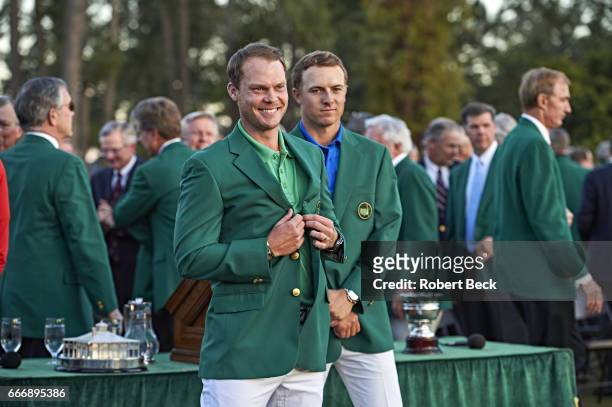 Danny Willett victorious, wearing green blazer during jacket ceremony at after winning tournament Augusta National. View of Jordan Spieth in the...