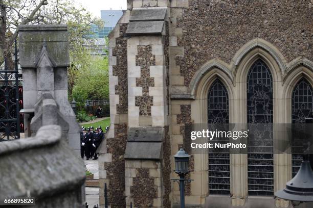 Police line the streets and thousands of people gather near Southwalk Cathedral as PC Keith Palmer's funeral is held in London, UK, on 10 April 2017....