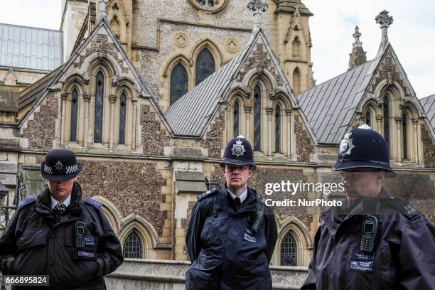 Police line the streets and thousands of people gather near Southwalk Cathedral as PC Keith Palmer's funeral is held in London, UK, on 10 April 2017....