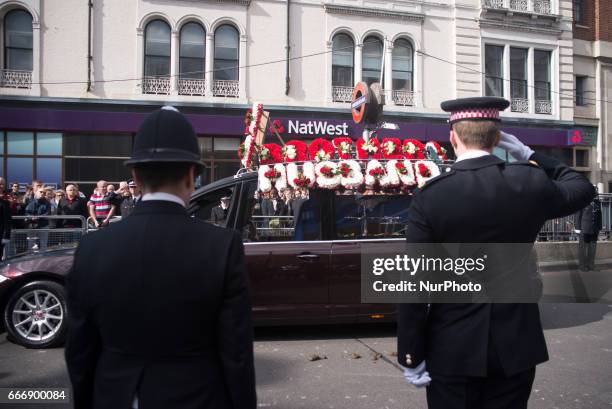 Hearse carrying the coffin of PC Keith Palmer makes its way down Southwark Street past lines of police officers after his funeral at Southwark...