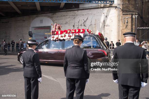 Hearse carrying the coffin of PC Keith Palmer makes its way down Southwark Street past lines of police officers after his funeral at Southwark...