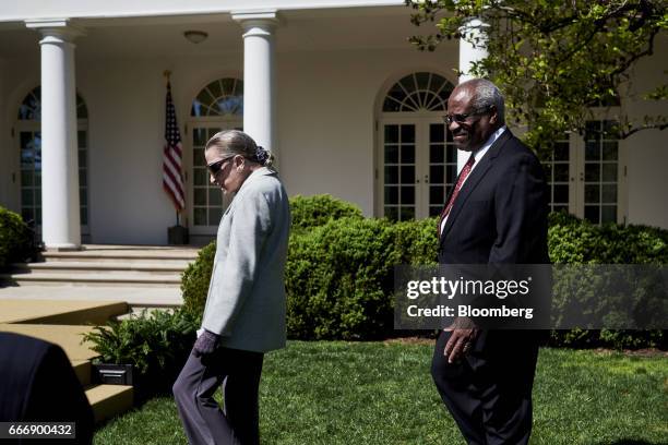 Supreme Court Justices Ruth Bader Ginsburg, left, and Clarence Thomas arrive at the swearing in ceremony of Judge Neil Gorsuch as U.S. Supreme Court...