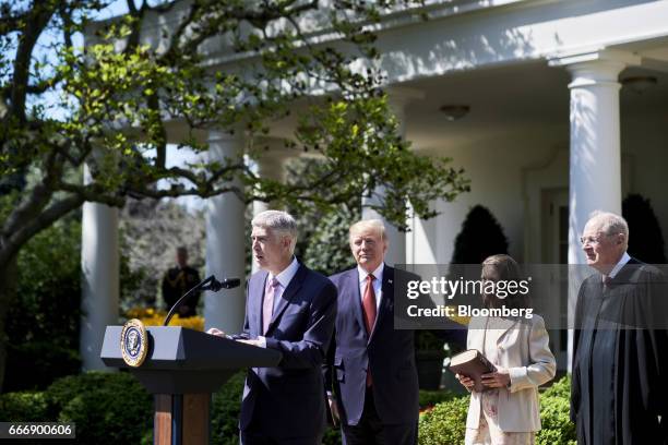 Supreme Court Justice Neil Gorsuch, from left, speaks after taking the oath of office as U.S. President Donald Trump, wife Louise Gorsuch, and...