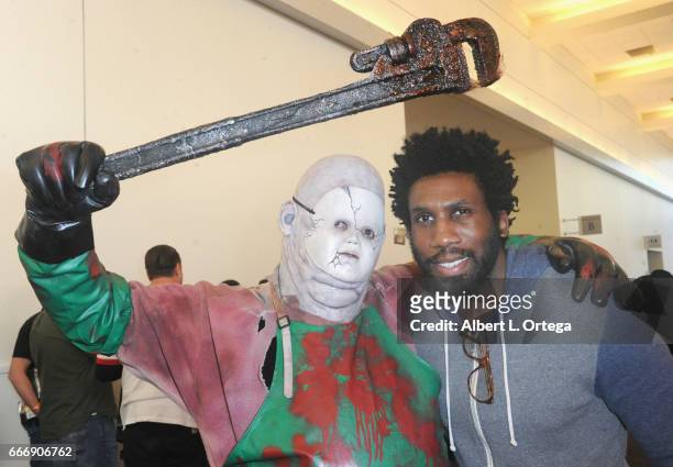Actor Nyambi Nyambi and horror cosplayer Chris Hannan attend day 2 of the 2017 Monsterpalooza held at Pasadena Convention Center on April 9, 2017 in...