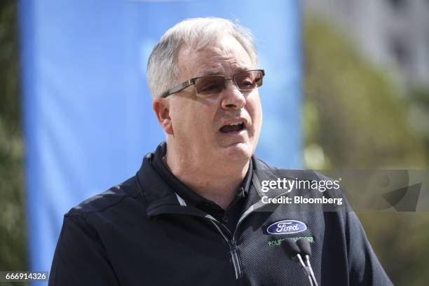 Kevin Koswick, director of North American fleet lease and remarketing at Ford Motor Co., speaks before the company's new Police Responder hybrid...