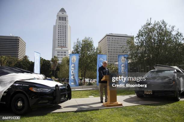 Kevin Koswick, director of North American fleet lease and remarketing at Ford Motor Co., speaks as the company's new Police Responder hybrid vehicles...