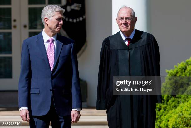 Supreme Court Associate Justices Neil Gorsuch and Anthony Kennedy are seen during a ceremony in the Rose Garden at the White House April 10, 2017 in...