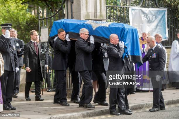 Pallbearers carry the coffin of PC Keith Palmer during his funeral service, on April 10, 2017 in London, United Kingdom. A Full Force funeral is held...