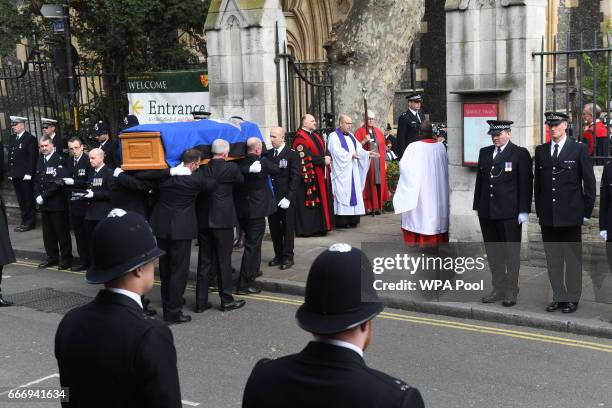 Pallbearers carry the coffin of PC Keith Palmer during his funeral service, on April 10, 2017 in London, United Kingdom. A Full Force funeral is held...