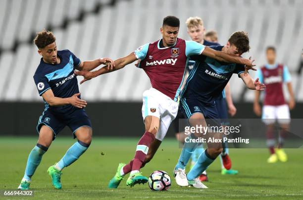 Ashley Fletcher of West Ham United takes on the Middlesbrough defence during the Premier League 2 match between West Ham United and Middlesbrough at...