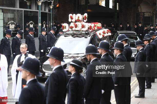 Police officers line the route in Southwark as the funeral procession of PC Keith Palmer makes its way to Southwark Cathedral, on April 10, 2017 in...