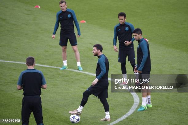 Barcelona's forward Lionel Messi from Argentina , Barcelona's forward Luis Suarez from Uruguay and Barcelona's forward Neymar from Brazil take part...