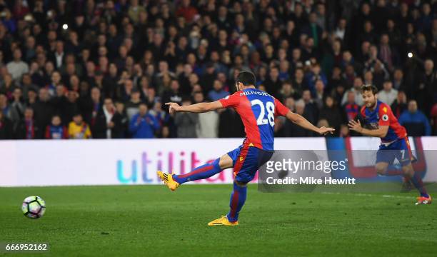 Luka Milivojevic of Crystal Palace scores their third goal from a penalty during the Premier League match between Crystal Palace and Arsenal at...