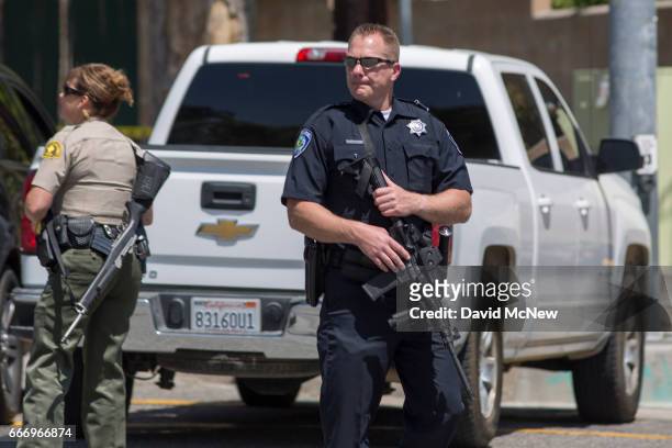 Police offers stand guard at North Park Elementary School following a shooting on campus on April 10, 2017 in San Bernardino, California. Two people...