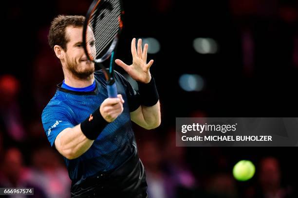 Britain's Andy Murray returns the ball to Swiss tennis superstar Roger Federer during a charity match "The Match for Africa 3" on April 10, 2017 in...