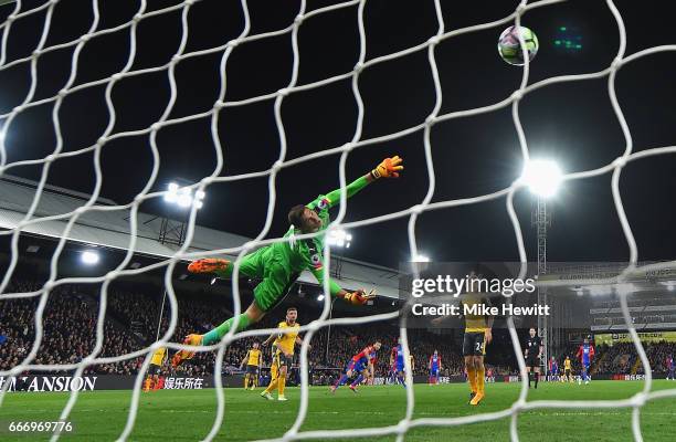 Emiliano Martinez of Arsenal fails to stop Yohan Cabaye of Crystal Palace from scoring their second goal during the Premier League match between...