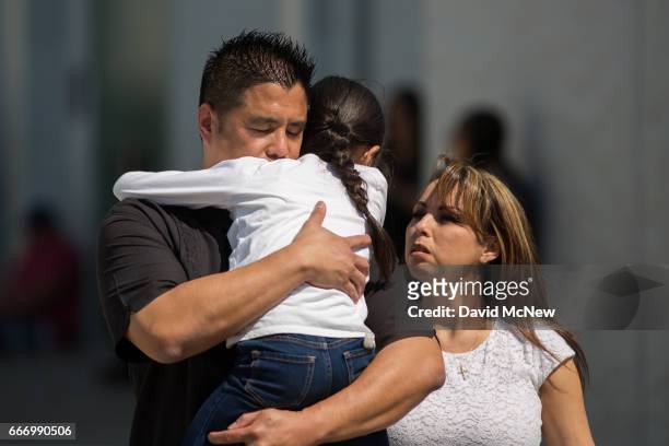 North Park Elementary School students and parents are reunited at Cajon High School after a shooting at their school on April 10, 2017 in San...